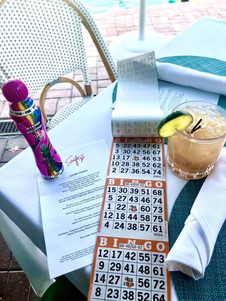Table with bingo sheet and cocktail